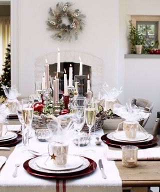 Christmas table centerpiece with candlesticks on tray