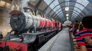 Guests waiting to board the Hogwarts Express at The Wizarding World of Harry Potter.