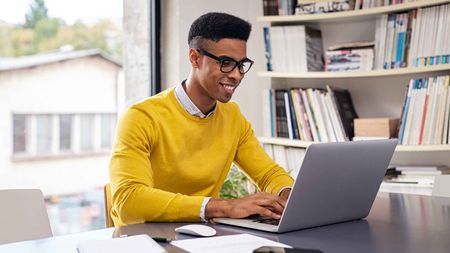 Photo of man working from home