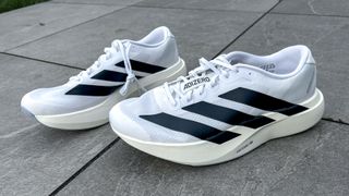 Adidas Adizero Evo SL placed on a sidewalk