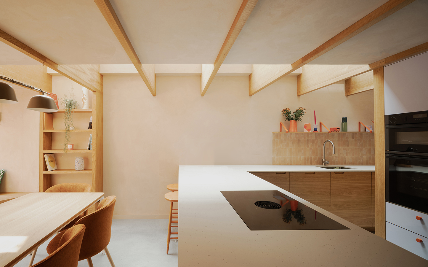 Pensaer's Clay House, earthy, natural interior showing a kitchen and dining area