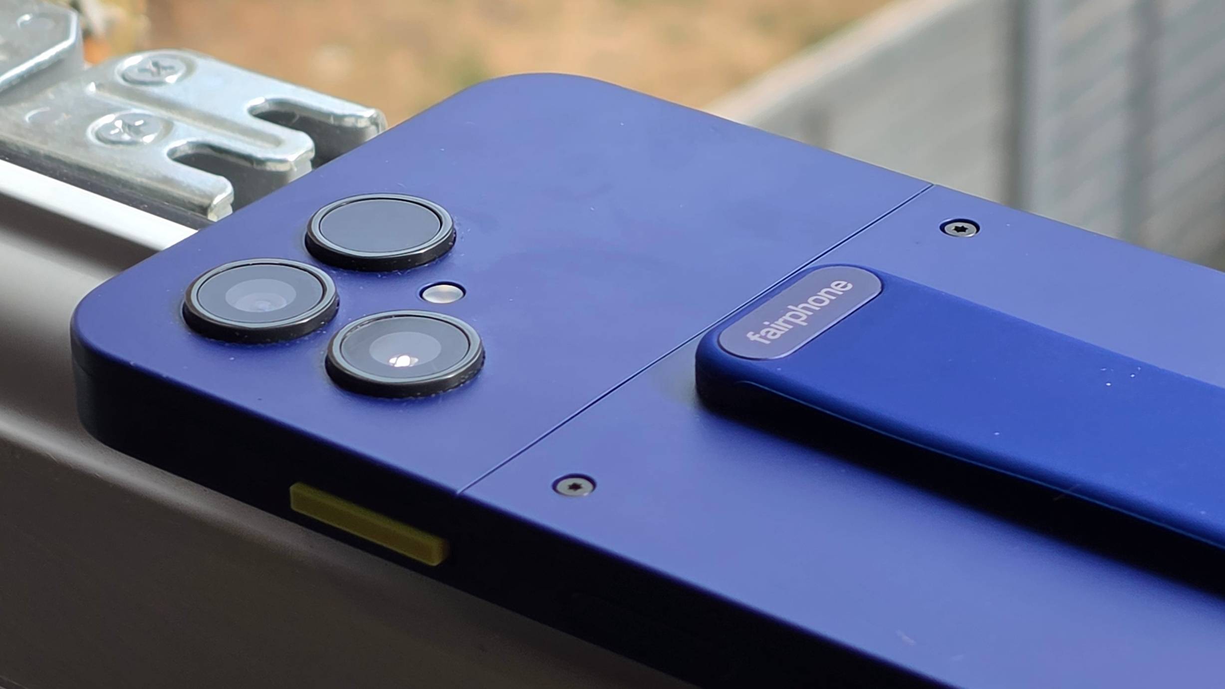 The Fairphone 6 Plus on a window sill, showing its camera bumps.