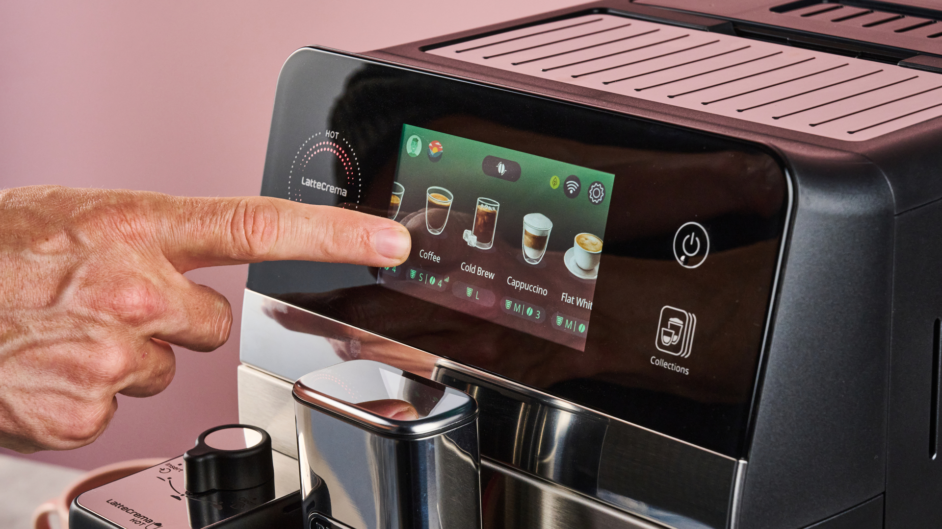 A man's hand swipes through the De'Longhi Eletta Ultra's drinks menu.