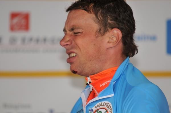 Benoit Daeninck (Roubaix Lille Metropole) winces as he pulls on the jersey