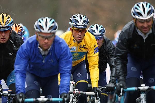 Alberto Contador had a yellow rain jacket on earlier but once it was soaked he changed to a black outfit.