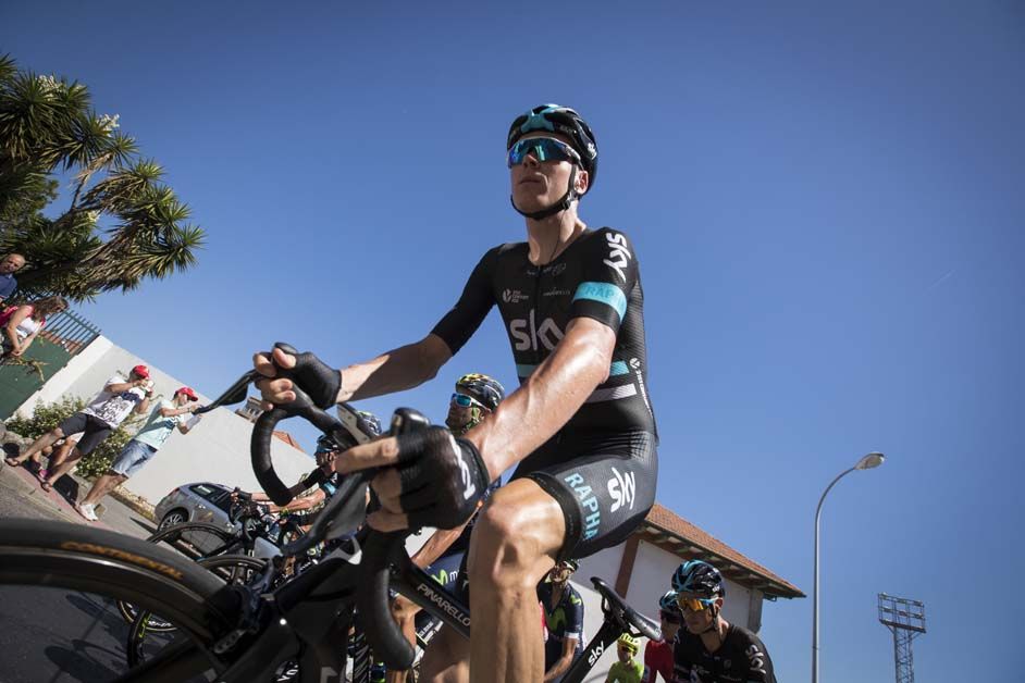 Chris Froome rides to sign on