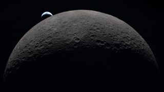 Earth sets at 6:41 p.m. EDT, April 6, 2026, over the Moon&rsquo;s curved limb in this photo captured by the Artemis 2 crew during their journey around the far side of the Moon. Orientale basin is perched on the edge of the visible lunar surface. 
