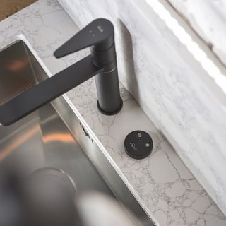 kitchen sink with black tap