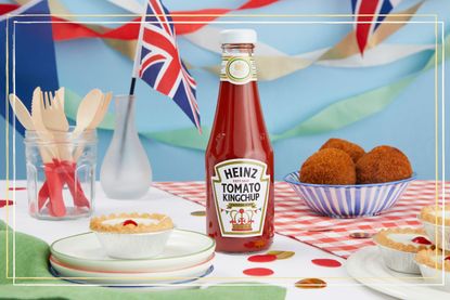 A bottle of Heinz Kingchup next to bunting, a Union Jack and bakewell tarts