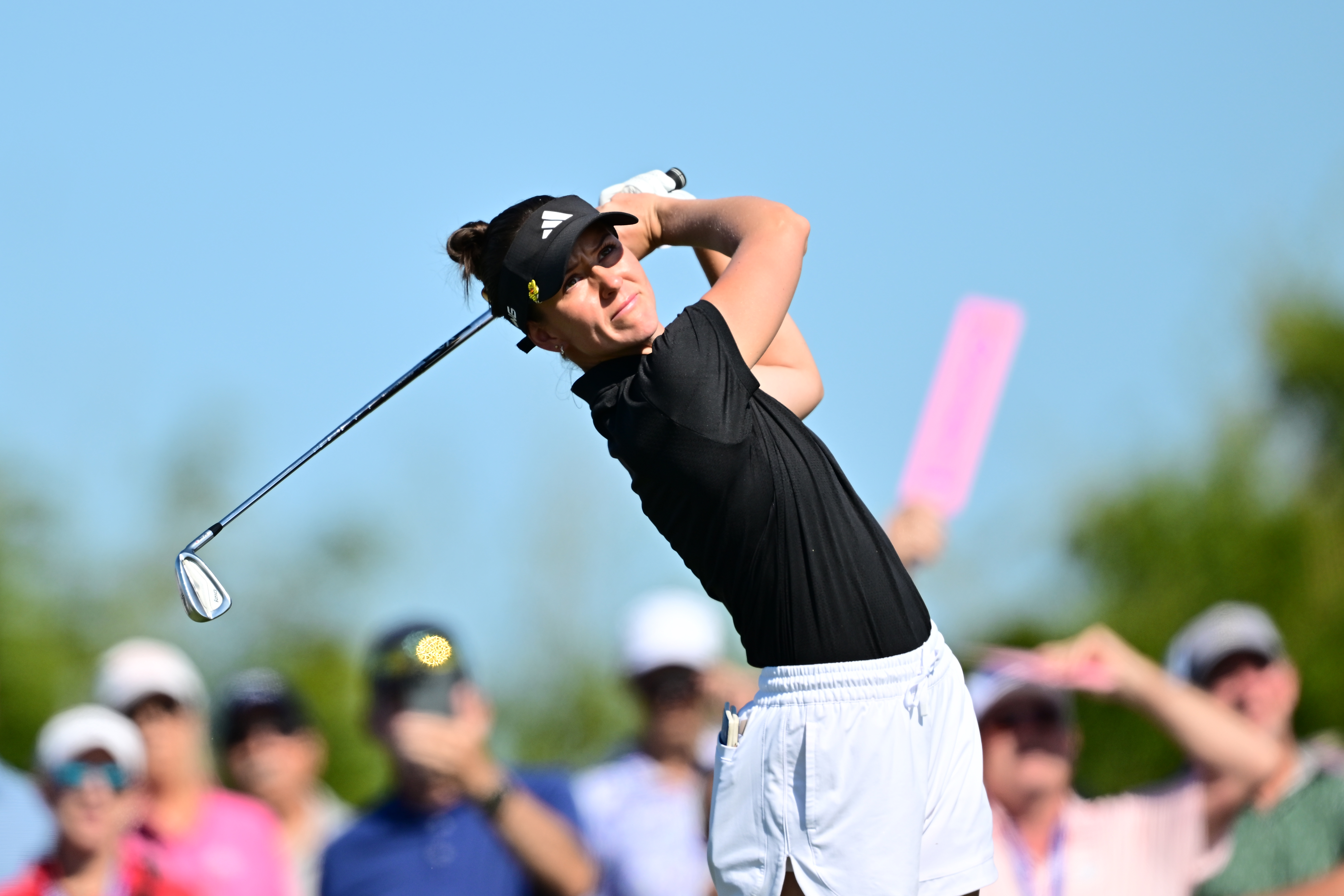 Linn Grant hits an iron from the fairway