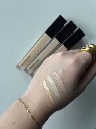 Hourglass concealer swatches on the back of a hand