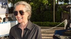 A HEADSHOT OF ANDIE MACDOWELL WEARING BLACK DRESS AND SUNGLASSES
