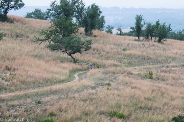 Georgia Gould (Luna Pro Team) riding alone through typical Texas hills country