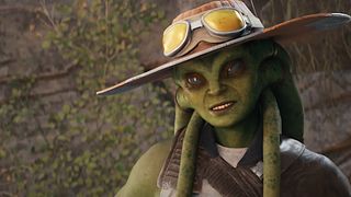 An image of Caij, a nautolan bounty hunter, tilting her head with a winning smile. She is wearing a wide-brimmed hat with goggles.