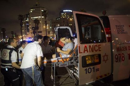 A victim of the Jaffa stabbing is transported to the hospital.