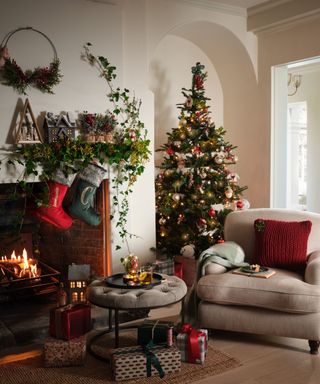 Christmas tree, stockings, red knitted cushion, half wreath