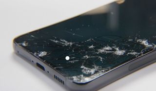 samsung galaxy s23 with shattered screen after drop test