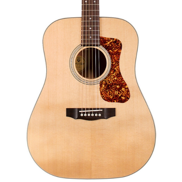 A Guild D-140 acoustic guitar