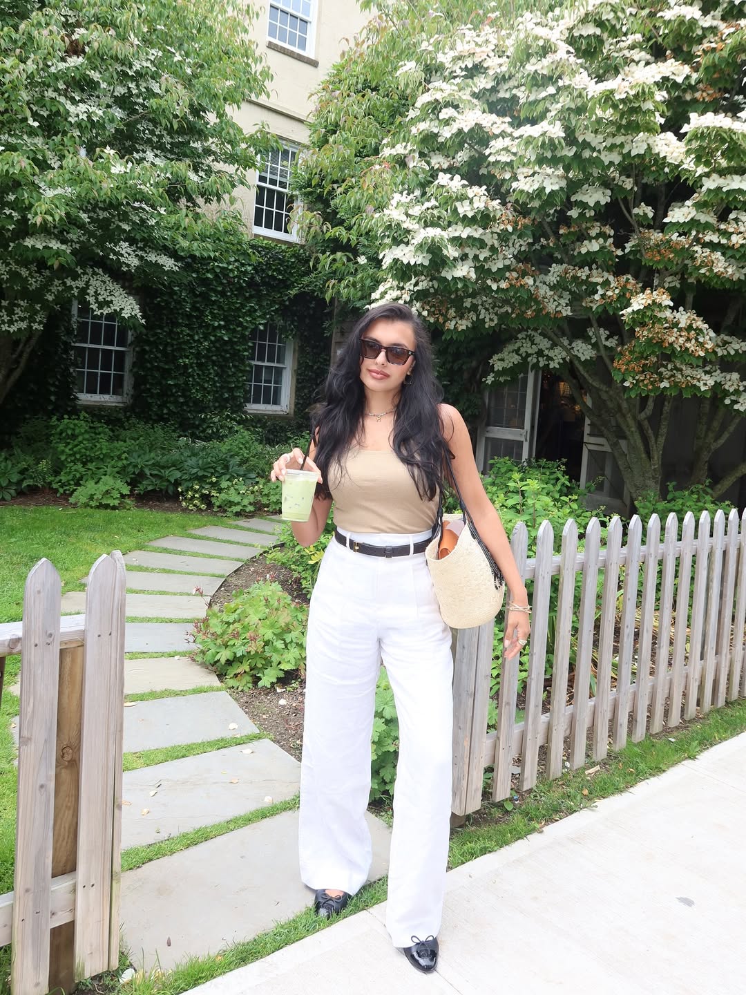 Renata in white jeans and beige tank top outfit