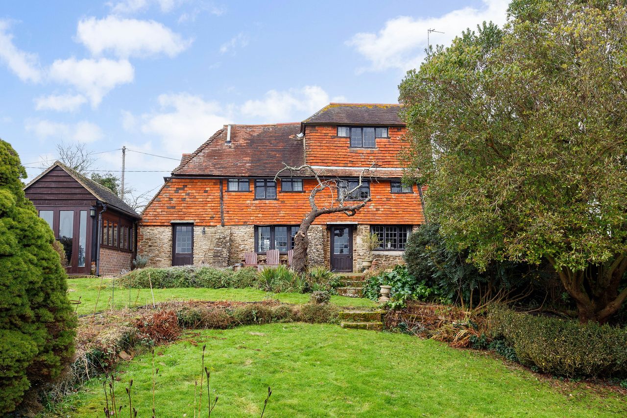 Images of a very wonky house called The Cottage