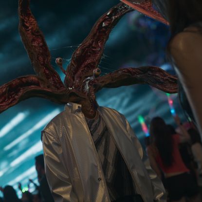 a man with knife-like tentacles protruding from the neck, in the netflix k-drama 'parasyte the grey'