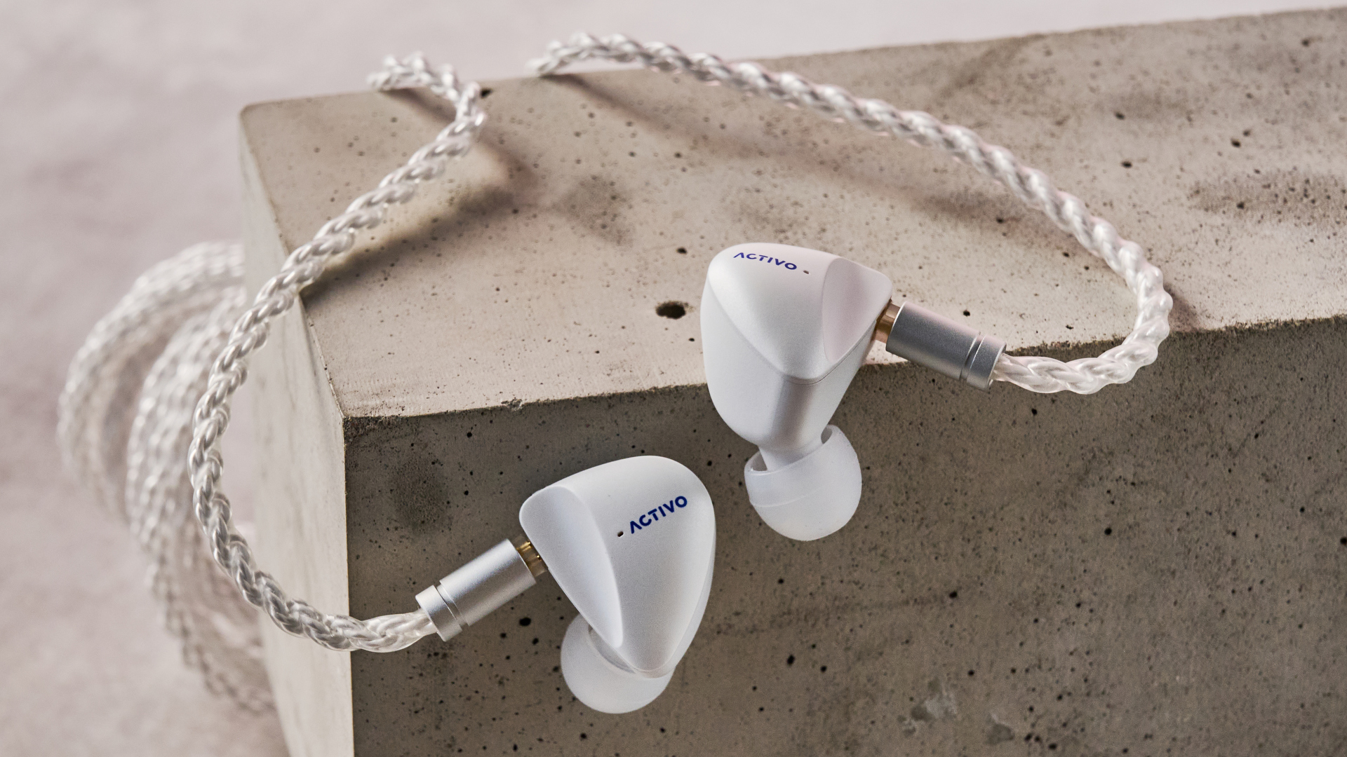 Activo Scoop earbuds balanced on block