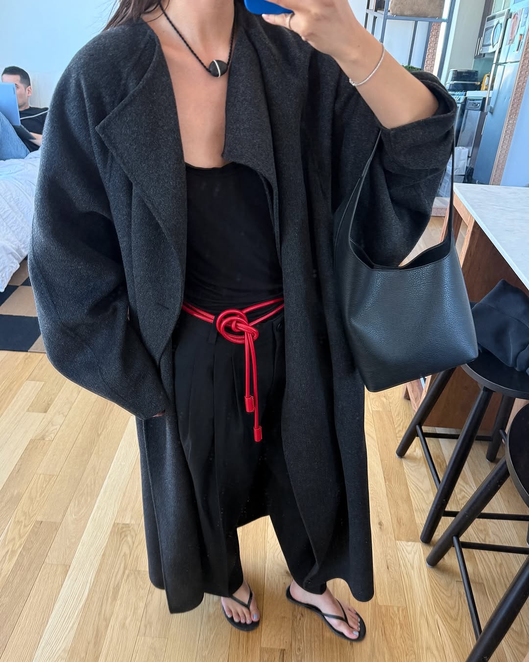 Woman wearing trouser pants and flip flops summer 2025.