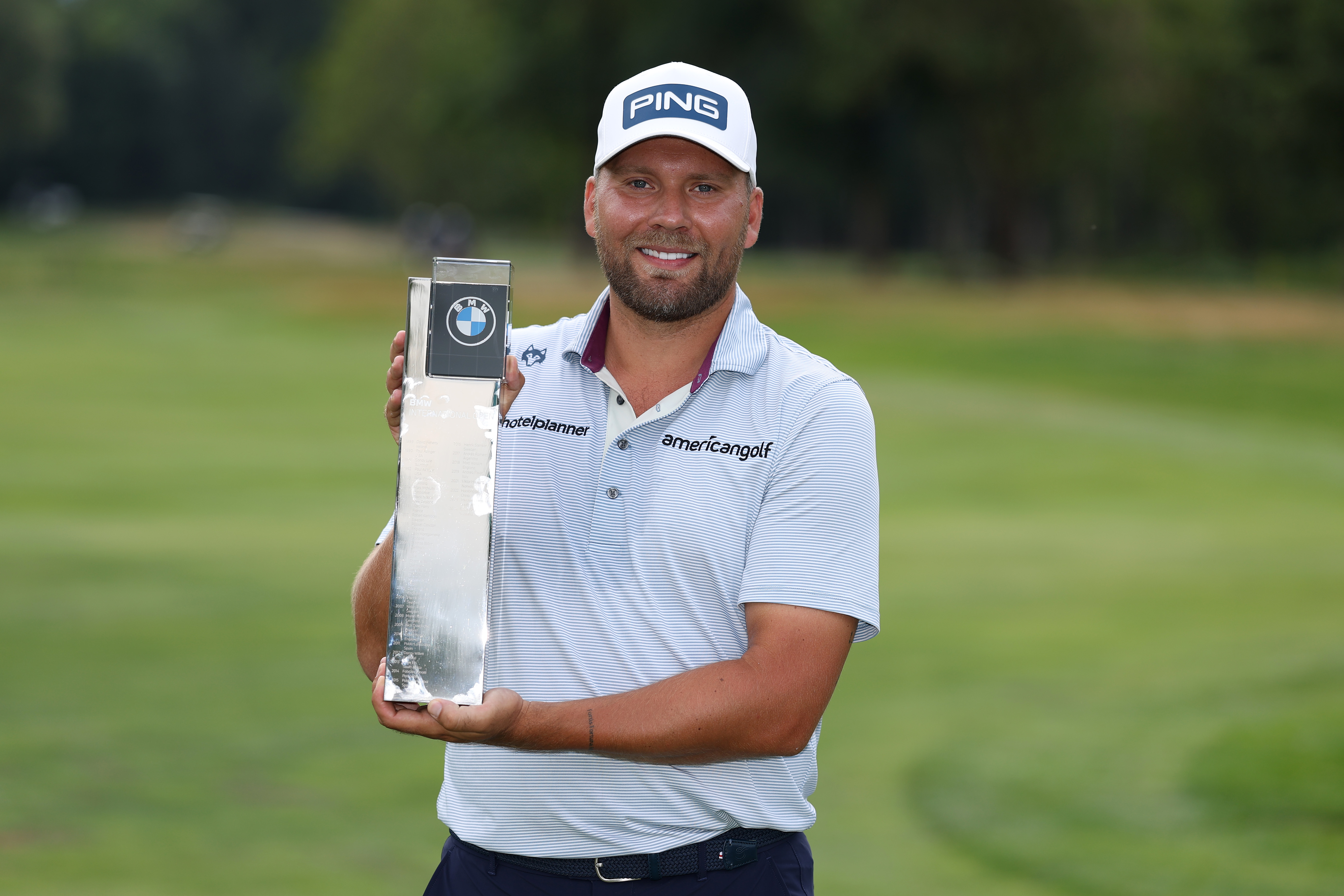 Daniel Brown holds the BMW International Open trophy
