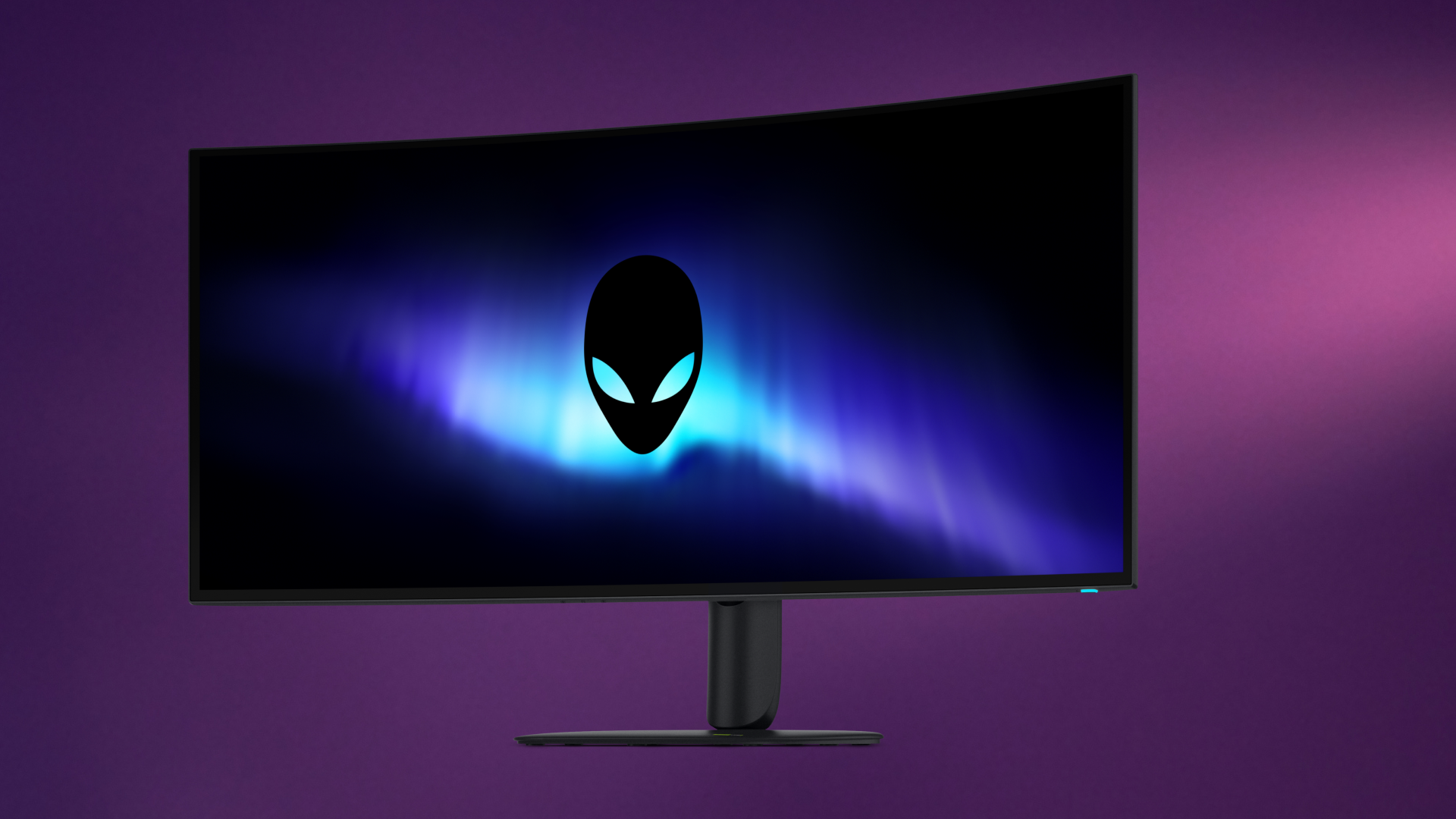 Front view of the curved Alienware 39 5K OLED monitor (AW3926QW) displaying the glowing Alienware head logo against a purple gradient background.