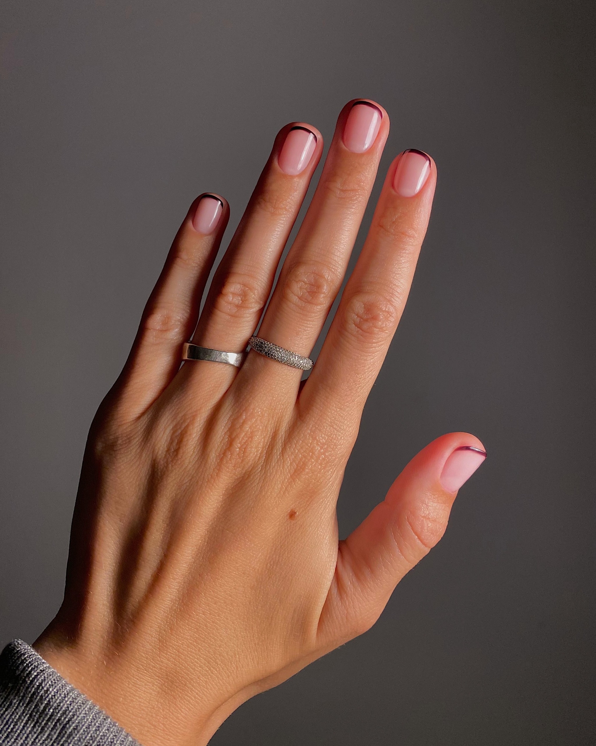 A picture of grape French tip nails