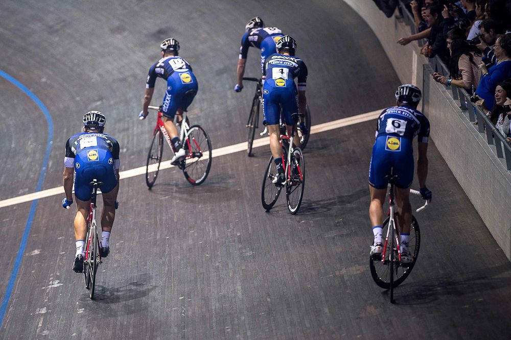Riders test their track-stand skills at the Etixx-QuickStep team presentation.