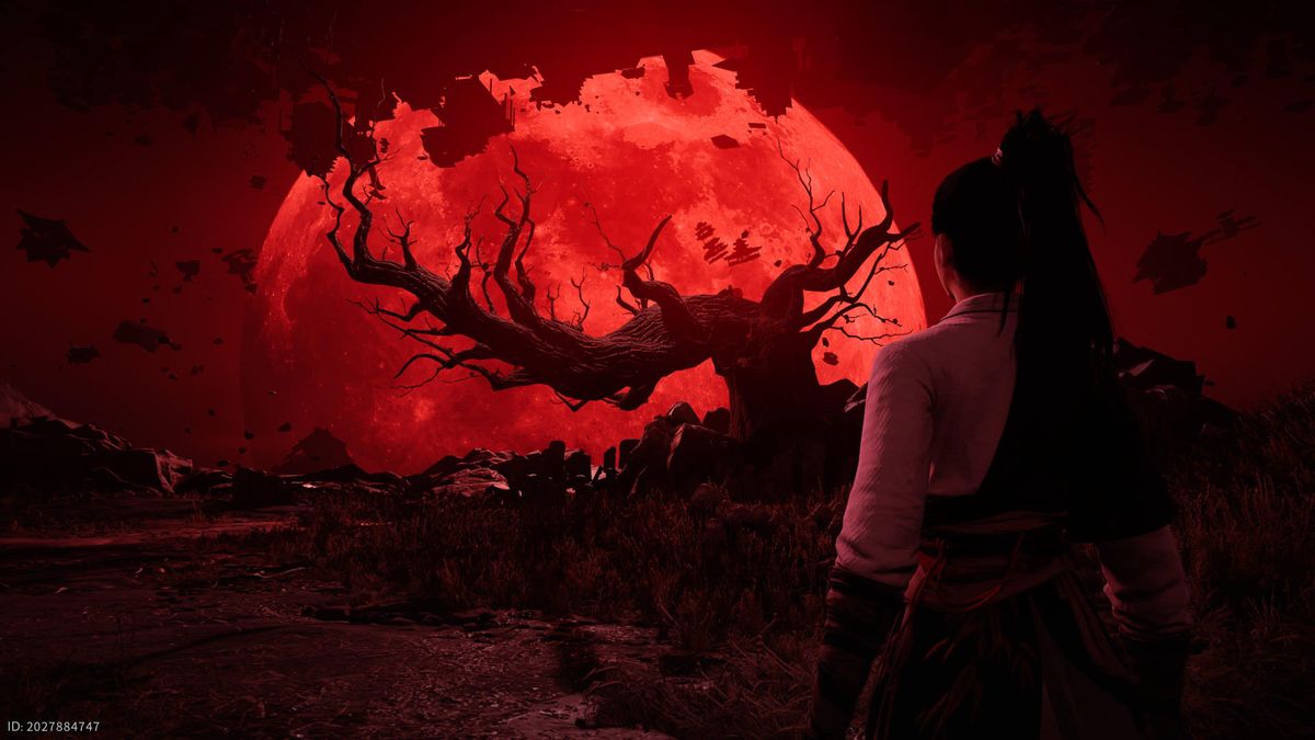 A red moon behind a gnarly dead tree in Where Winds Meet