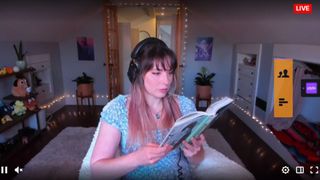Twitch stream featuring a woman silently reading a book
