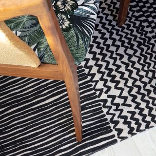 rug with patterned and wooden chair