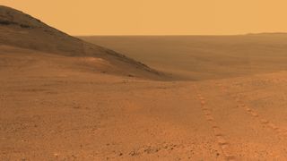 Tracks from NASA's Opportunity rover on Mars are visible on the Martian surface in this image taken in June 2017. After months of silence from Opportunity due to a dust storm on Mars, NASA has begun a 45-day campaign to reestablish contact with the rover.