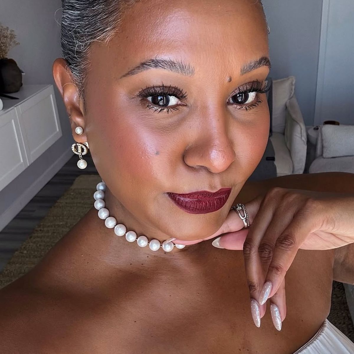 A woman wearing matte lipstick.