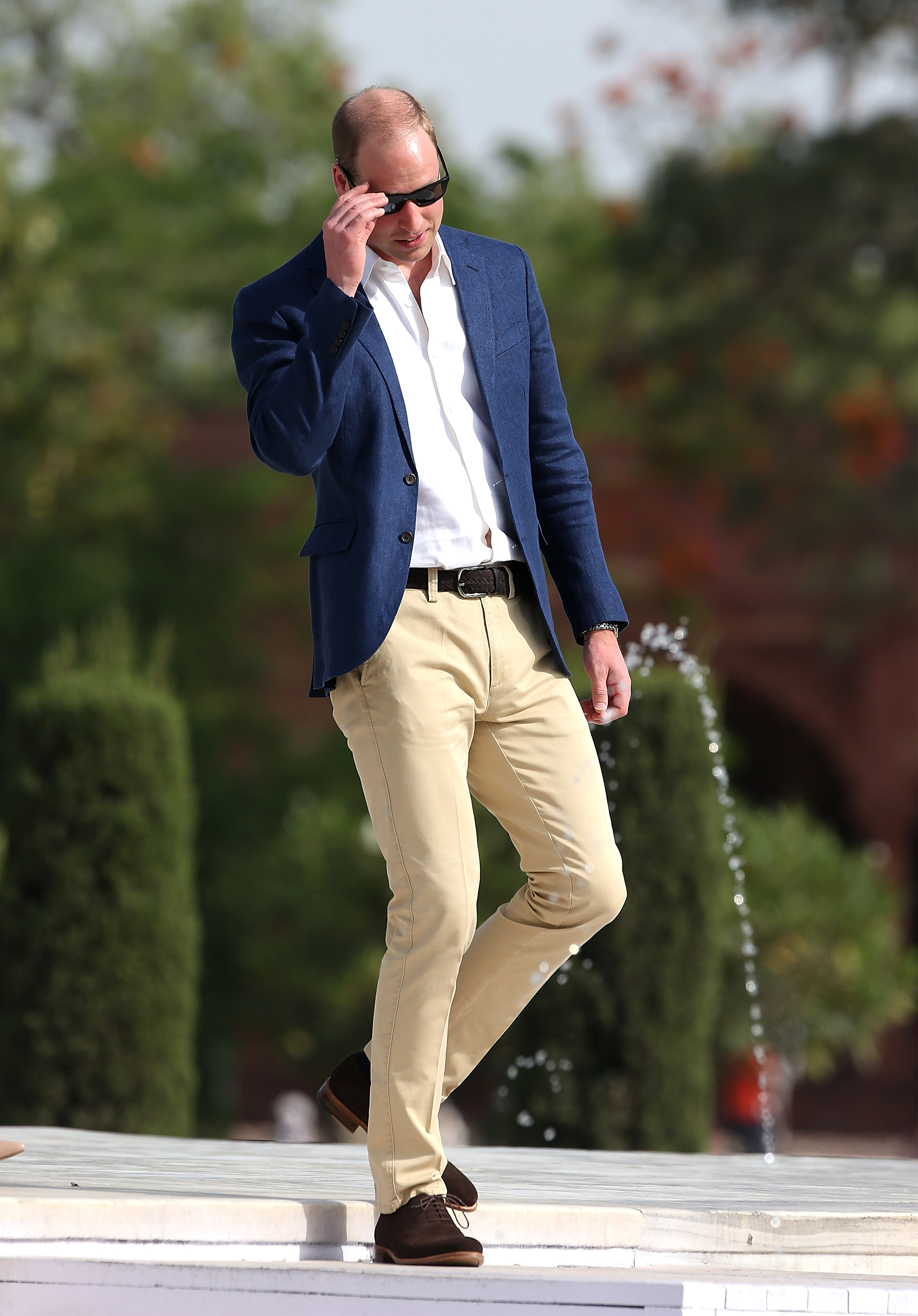 Prince William wearing a sport coat and sunglasses