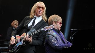 Davey Johnstone and Elton John perform at BankAtlantic Center on March 9, 2012 in Sunrise, Florida