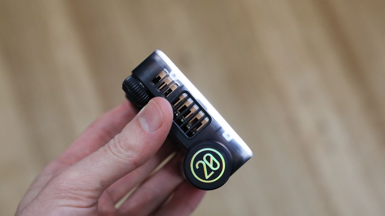 Zhiyun FIVERAY M20C LED panel side view held in a hand