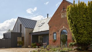 zinc two storey extension to brick converted chapel