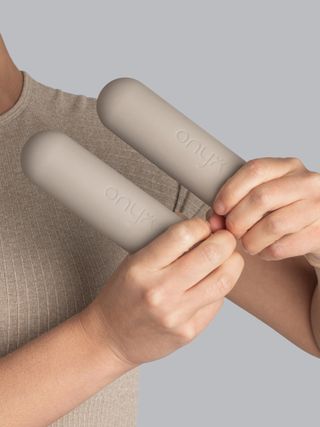 Two beige hand weights