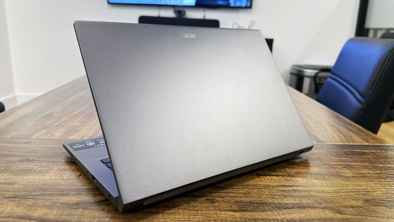 Acer Swift X 14 facing away on a wooden table