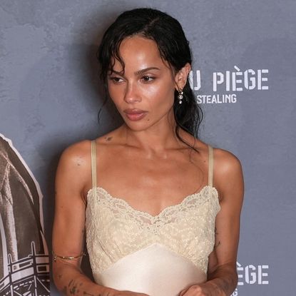 Zo&euml; Kravitz walked the red carpet at the 'Caught Stealing' Paris premiere in a lace-trimmed lingerie slip dress