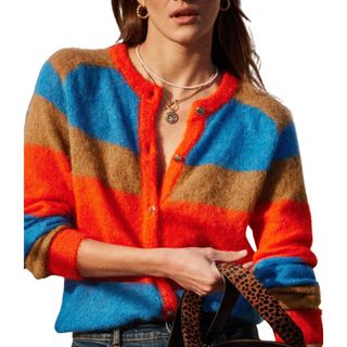 woman wearing blue and red striped fluffy cardigan