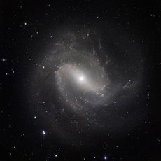 Hot Stars Found Hidden in Galaxy's Dusty Embrace Image
