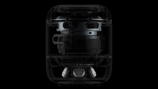 The Apple HomePod speaker on a black background