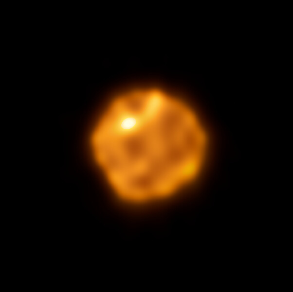 a mottled red-orange orb on a black background