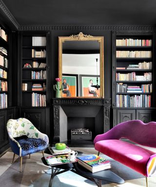 black living room with pink chair