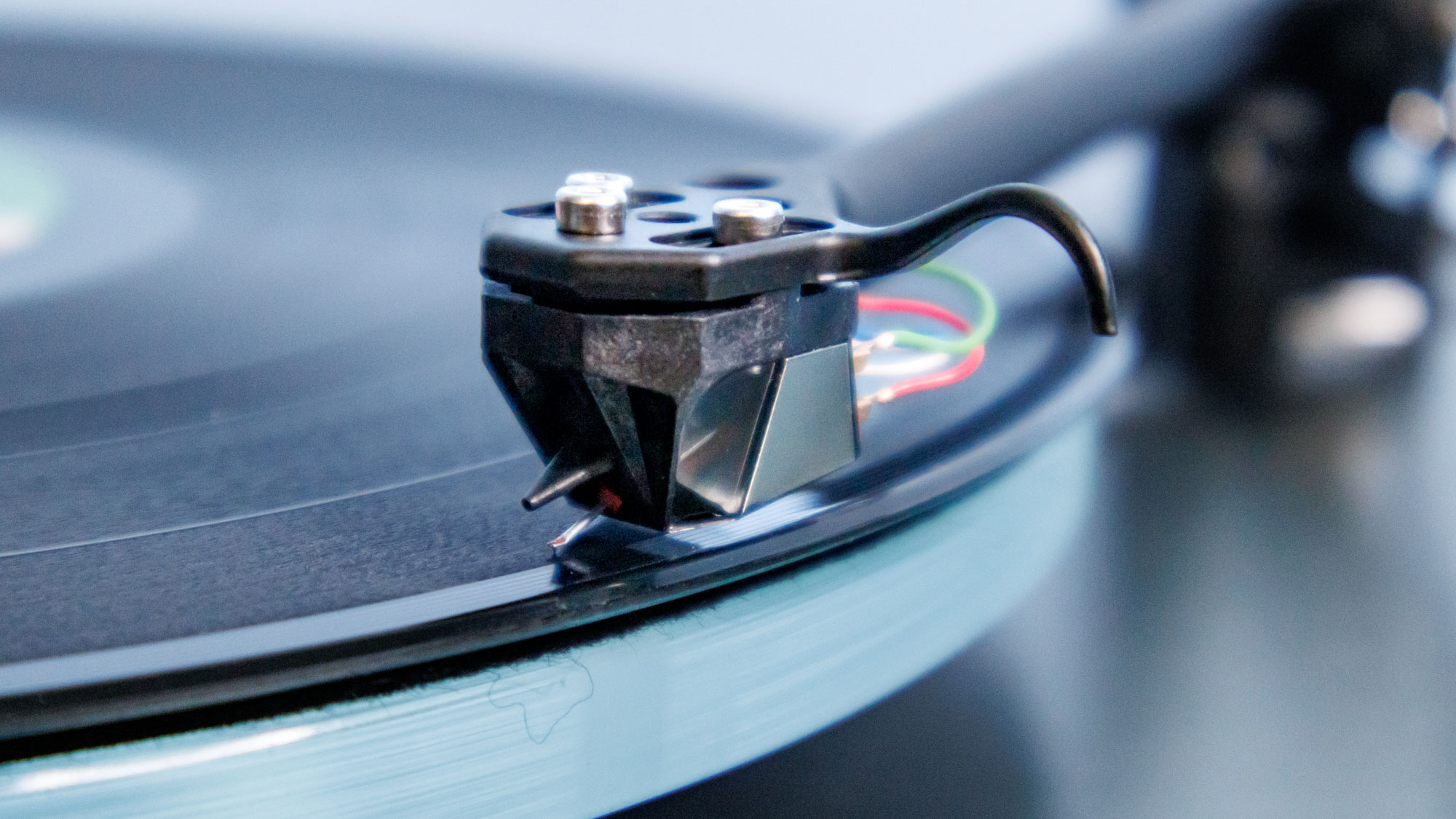 The Rega Planar 3 RS on an entertainment stand.