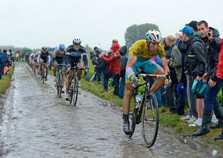 Vincenzo Nibali powers over the cobbles near Brillon in northern France during stage five of the Tour de France. His bike handling skills over the mud and rain-covered pavé helped him place third on the stage and stay in yellow (Jones)